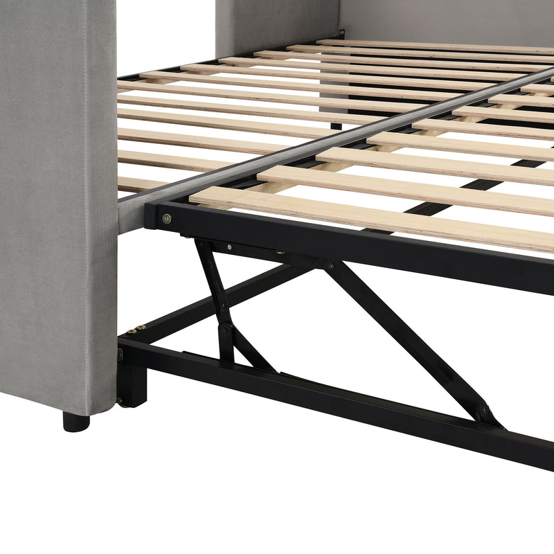 Twin size upholstered daybed with pop-up trundle from Halcyon Home, featuring plush fabric and space-saving design.