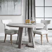 Uttermost Gidran dining table with a sleek wooden top and modern design, perfect for contemporary dining rooms.