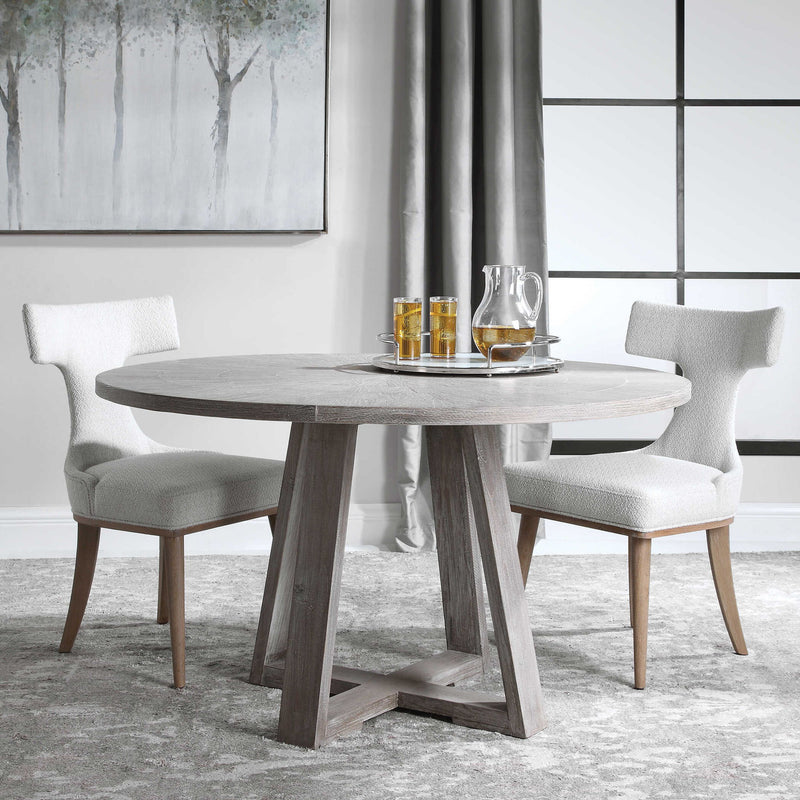 Uttermost Gidran dining table with a sleek wooden top and modern design, perfect for contemporary dining rooms.