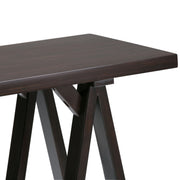 Handcrafted Simpli-Home console sofa table with a sleek wooden top and sturdy legs, designed for versatile living room use.