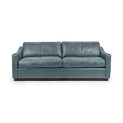 Classic Home Aspen stationary sofa with plush cushions and neutral fabric, showcasing a modern, comfortable living room centerpiece.