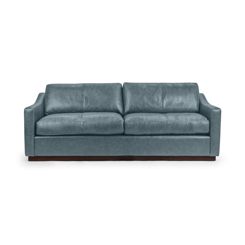 Classic Home Aspen stationary sofa with plush cushions and neutral fabric, showcasing a modern, comfortable living room centerpiece.