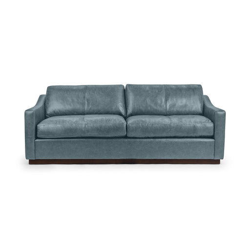 Classic Home Aspen stationary sofa with plush cushions and neutral fabric, showcasing a modern, comfortable living room centerpiece.