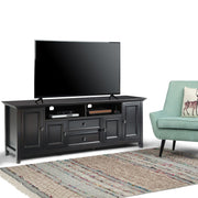 Handcrafted Amherst wide TV media stand by Simpli-Home featuring wood finish, open shelving, and sturdy design for media storage.