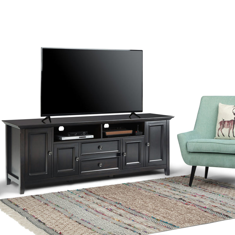 Handcrafted Amherst wide TV media stand by Simpli-Home featuring wood finish, open shelving, and sturdy design for media storage.