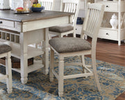 Set of two beige upholstered barstools from Signature Design by Ashley, featuring padded seats and modern design for kitchen or bar areas.