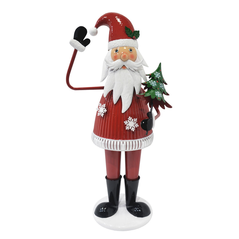Cheerful Christmas Santa Claus figure from Noble House holding a tree and waving, festive holiday decoration in red.