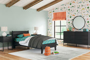 Signature Design by Ashley Socalle 3-piece bedroom set with bed frame, dresser, and nightstand in a modern bedroom.