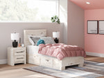 Signature Design by Ashley Lawroy panel bed with built-in storage drawers, showcasing a modern wooden storage bed design.