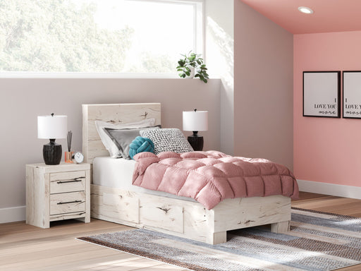 Signature Design by Ashley Lawroy panel bed with built-in storage drawers, showcasing a modern wooden storage bed design.