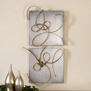 Gold metal wall art set by Uttermost featuring two modern decorative wall decor pieces with intricate geometric designs.