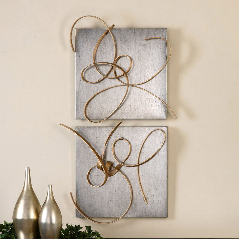 Gold metal wall art set by Uttermost featuring two modern decorative wall decor pieces with intricate geometric designs.