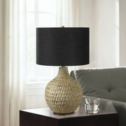 Contemporary brown resin table lamp with a sleek, modern design, perfect for adding stylish lighting to living spaces.