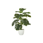 Artificial Monstera plant in a decorative pot, showcasing lush green, realistic leaves for home or office decor.