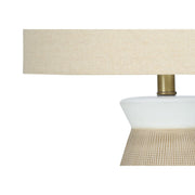 Contemporary cream ceramic and resin table lamp by 8th Street, featuring a sleek design and soft lighting for modern decor.