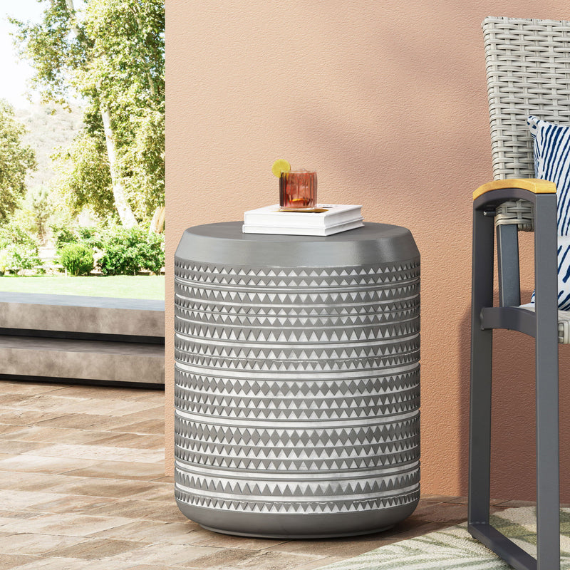 White cylindrical outdoor side table by Noble House, featuring a sleek design perfect for patio or garden decor.