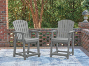 Set of two Sanctuary Beach barstools by Signature Design in dark gray with sleek, modern design and cushioned seats.