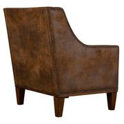 Dark brown leather armchair from Uttermost, featuring a plush cushioned seat and stylish armrest design.
