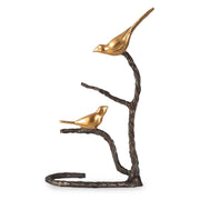 Black and gold "Birds On A Limb" sculpture by Uttermost, featuring detailed bird figurines perched on a branch.