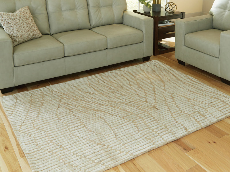 Signature Design by Ashley Jaseena area rug with intricate geometric patterns and soft neutral colors, perfect for living rooms.
