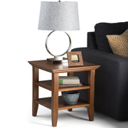 Handcrafted Acadian end table by Simpli-Home with a wooden finish, featuring a simple design and sturdy legs.