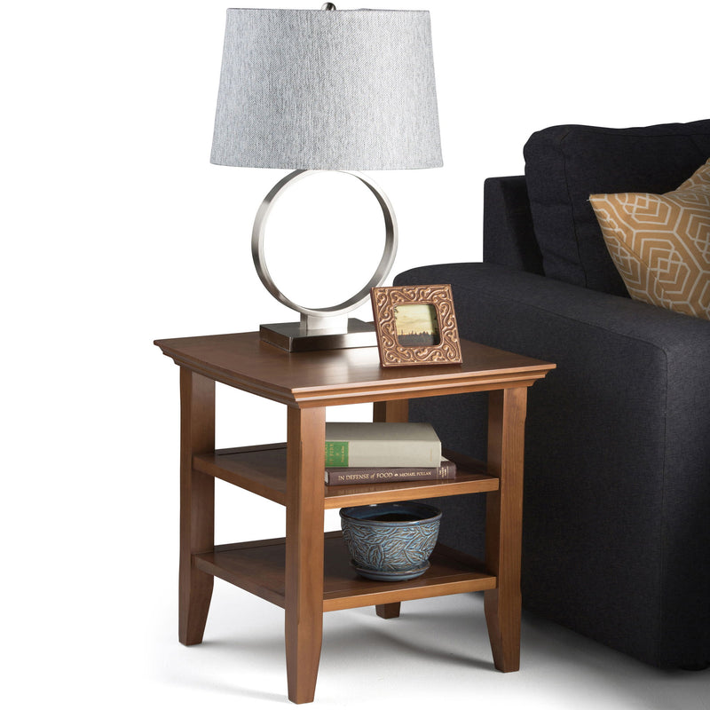 Handcrafted Acadian end table by Simpli-Home with a wooden finish, featuring a simple design and sturdy legs.