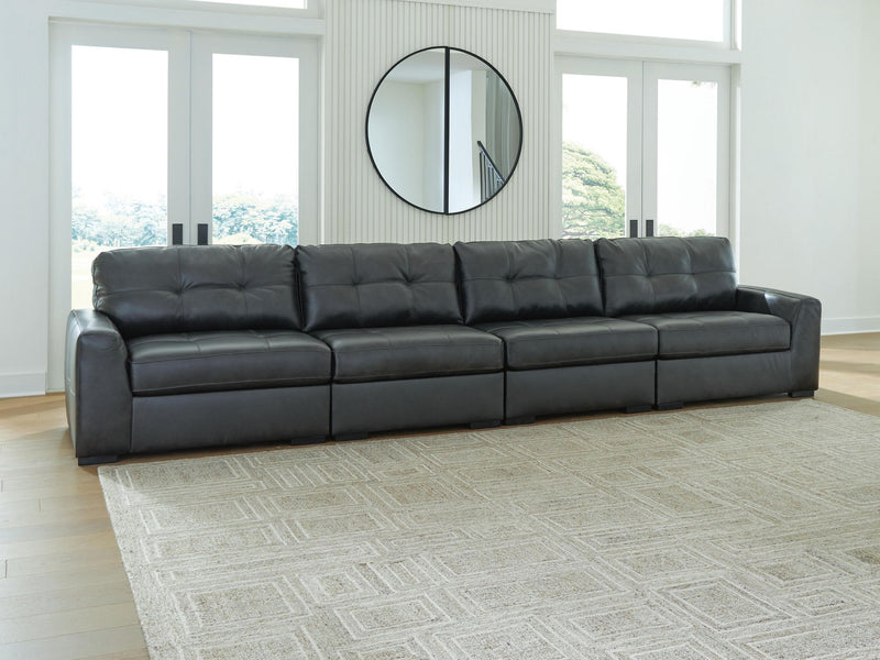 Signature Design by Ashley® Brindley Pier sectional sofa in neutral fabric with plush cushions and wide armrests.