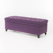 Noble House Juliana storage ottoman with fabric top and birch wood legs, offering stylish extra seating and hidden storage.