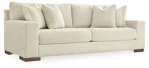 Signature Design by Ashley Maggie stationary sofa with plush cushions and neutral fabric, ideal for living room seating.