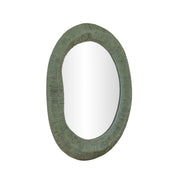TOV Furniture Orpheus 22x28 inch forest green ribbed fiberglass thick wall mirror hanging on a wall.