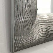 Silver metallic wall mirror by Uttermost, Maeona style, with a sleek round frame reflecting contemporary decor.
