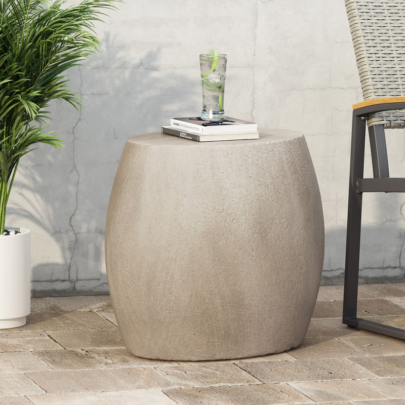 Outdoor oval-shaped side table by Noble House, featuring a durable design ideal for patio or garden decor.