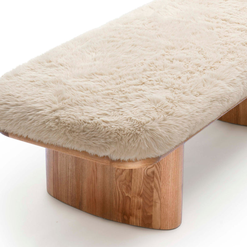 Upholstered Ollie straight bench by TOV Furniture with cushioned seat and sleek wooden legs, ideal for entryways or living spaces.