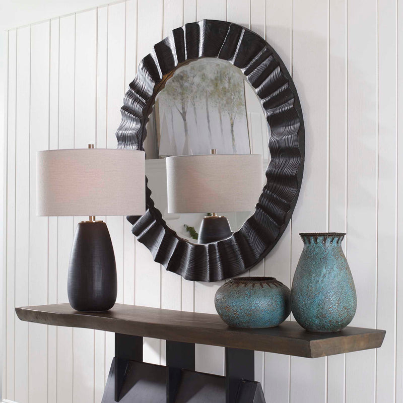 Black Caribou Round Accent Mirror by Uttermost with a sleek, modern design and a smooth black finish.