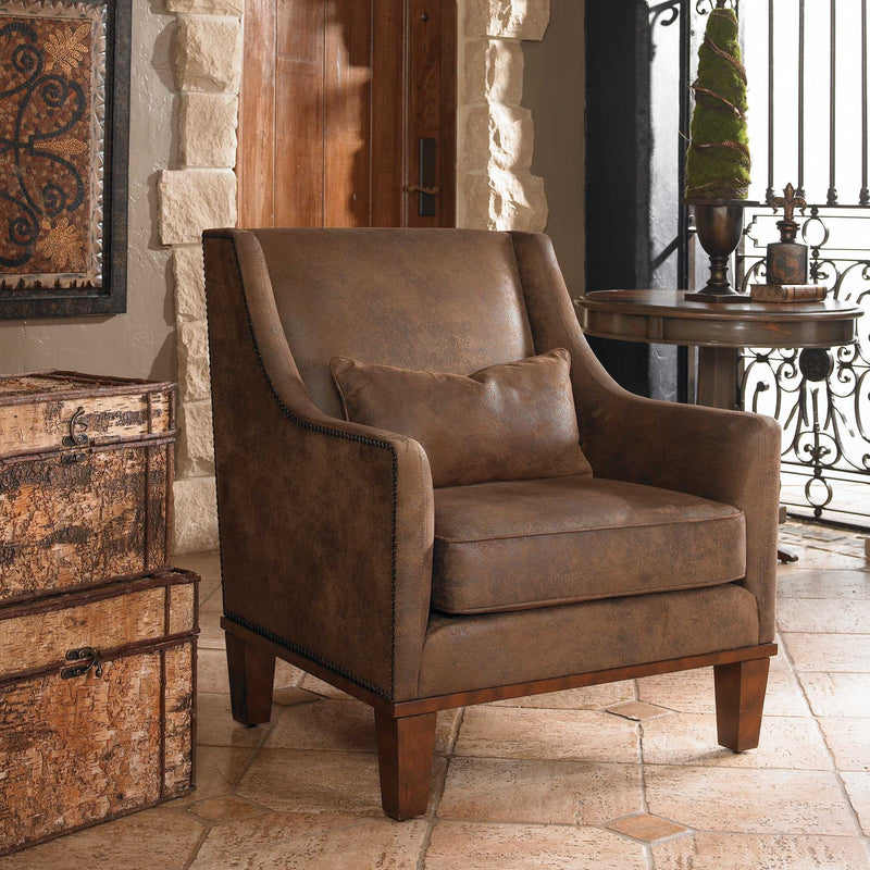 Dark brown leather armchair by Uttermost featuring a classic, comfortable design with plush cushioning and stylish armrests.