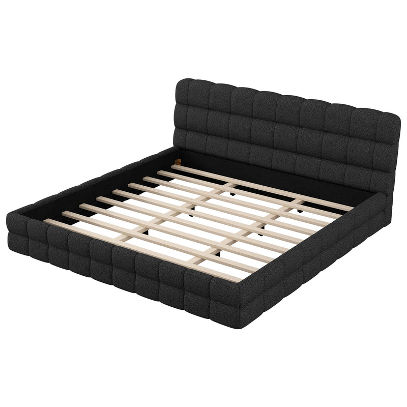 Dreamland upholstered platform bed with a padded headboard, showcasing a modern design and soft fabric upholstery.