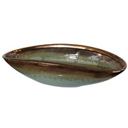 Green Iroquois glaze bowl by Uttermost, showcasing a smooth, rounded ceramic plate with a glossy green finish.