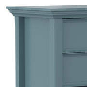 Handcrafted Amherst bedside table by Simpli-Home, featuring a wooden surface and storage drawer, ideal for bedroom décor.