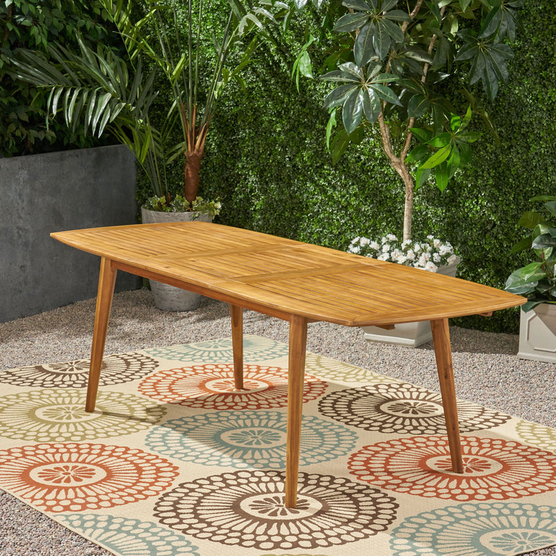 Noble House Placidity outdoor expandable dining table with slatted tabletop and tapered legs, ideal for outdoor dining spaces
