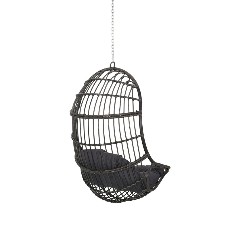 Rustic Noble House hanging basket chair with cushion, ideal for indoor or outdoor lounging and relaxation.