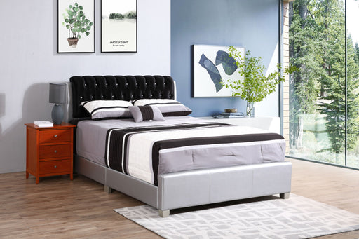 Tufted upholstered bed by Glory Furniture featuring a plush headboard and modern design in a cozy bedroom setting.