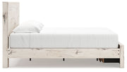 Signature Design by Ashley Lawroy storage panel bed with built-in under-bed storage drawers in a modern bedroom setting.