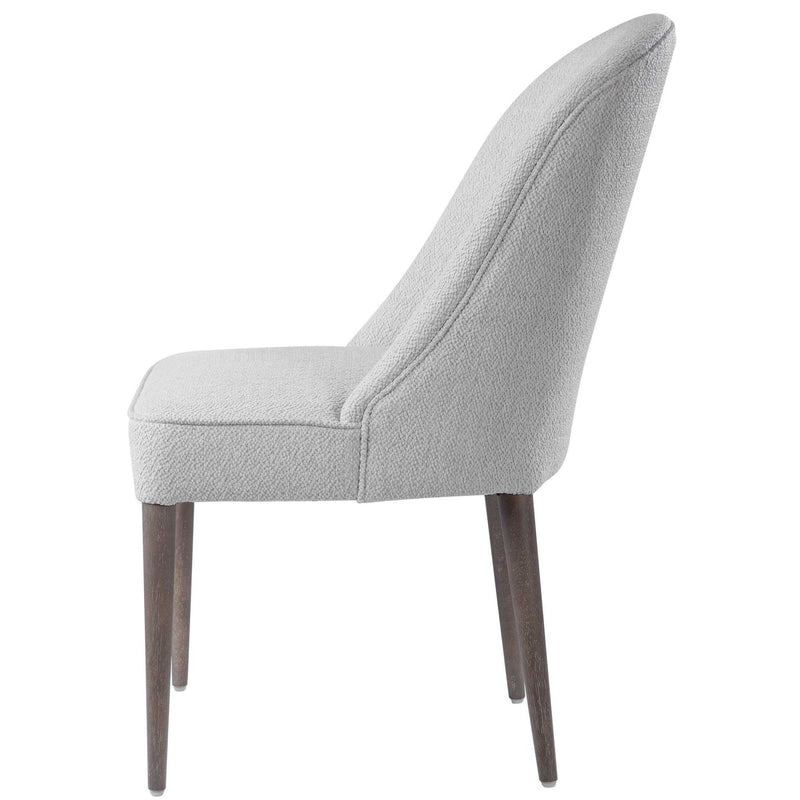 Set of two Uttermost Brie armless chairs with modern design, upholstered in light fabric, featuring sleek metal legs.