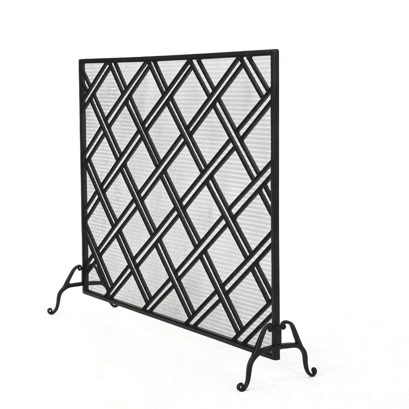 Noble House elegant fireplace screen with intricate metal design, serving as a protective barrier for a cozy fireplace.