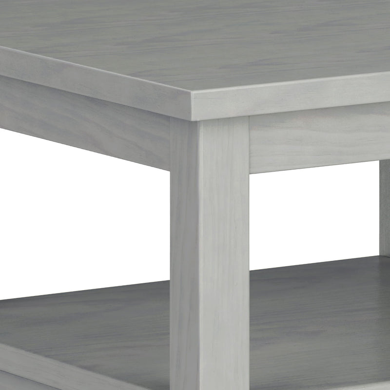 Handcrafted Warm Shaker coffee table by Simpli-Home featuring a natural wood finish and sturdy wooden legs.