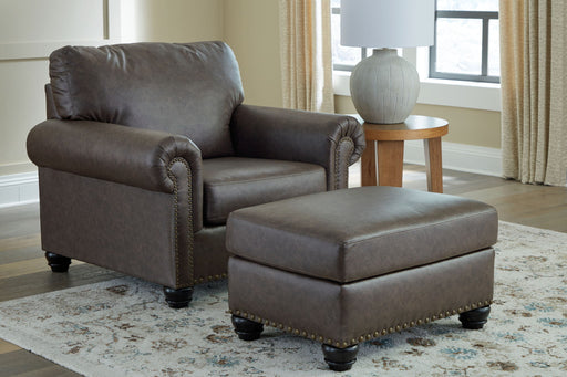 Benchcraft Roxmere living room set with stationary chair and matching ottoman, featuring plush upholstery and contemporary design.