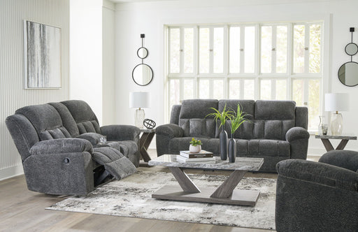 Signature Design by Ashley Frohn reclining living room sofa with plush fabric, padded armrests, and built-in recliner mechanism.