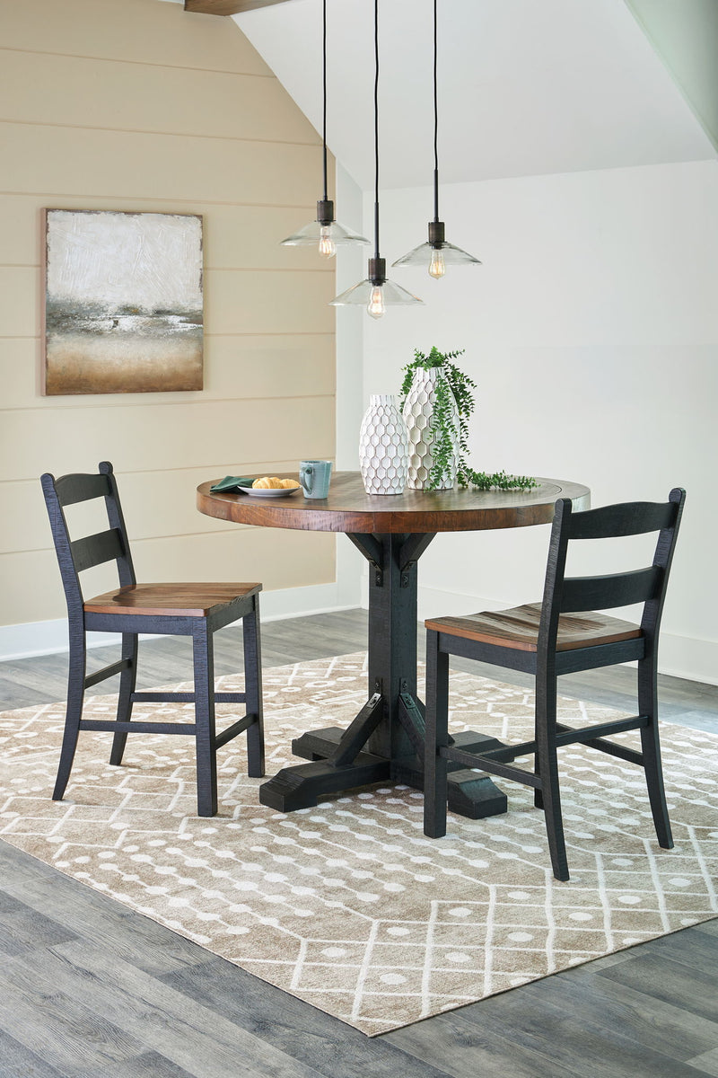 Signature Design by Ashley Valebeck counter height dining room set with four matching pieces, including table and chairs.