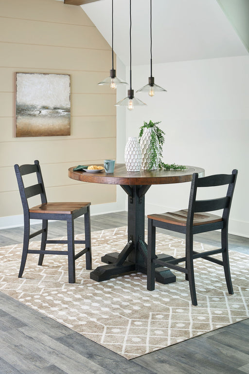 Signature Design by Ashley Valebeck counter height dining room set with four matching pieces, including table and chairs.