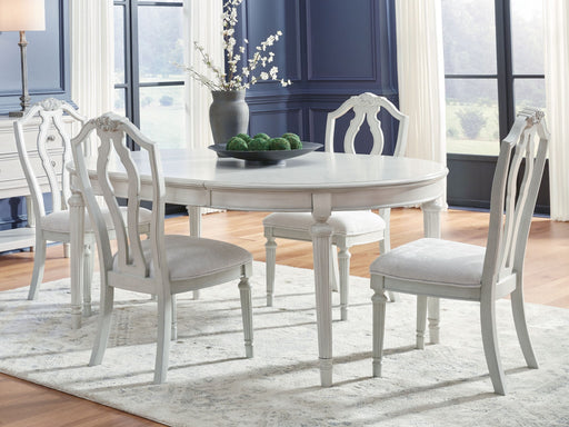 Benchcraft Montelaine 6-piece dining room extension table set with a wood finish and matching chairs in a modern dining space.